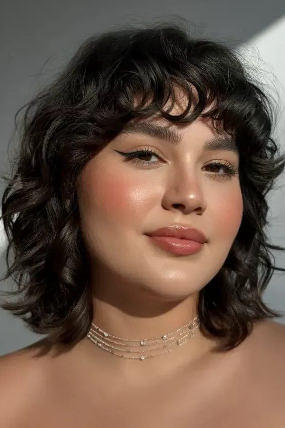 Dark Brown Curly Bob with Soft Waves and Face-Framing Fringe