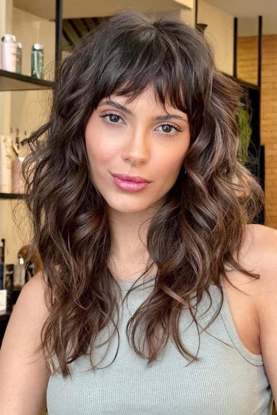 Dark Brown Shaggy Hairstyle with Loose Curls and Piece-y Bangs