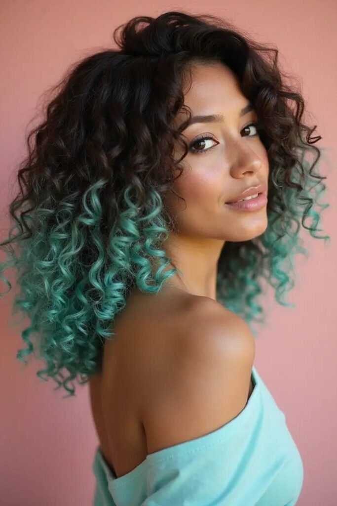 Dark Curly Hair with Vibrant Teal Dip-Dye Ends