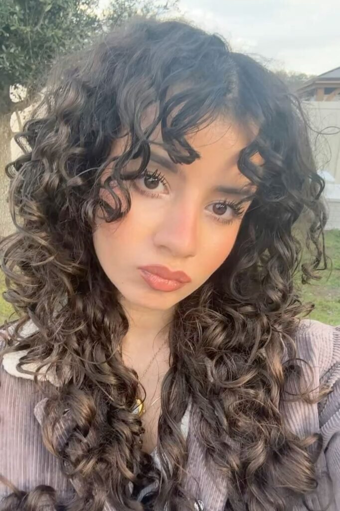 Dark Curly Shag with Soft Face-Framing Bangs