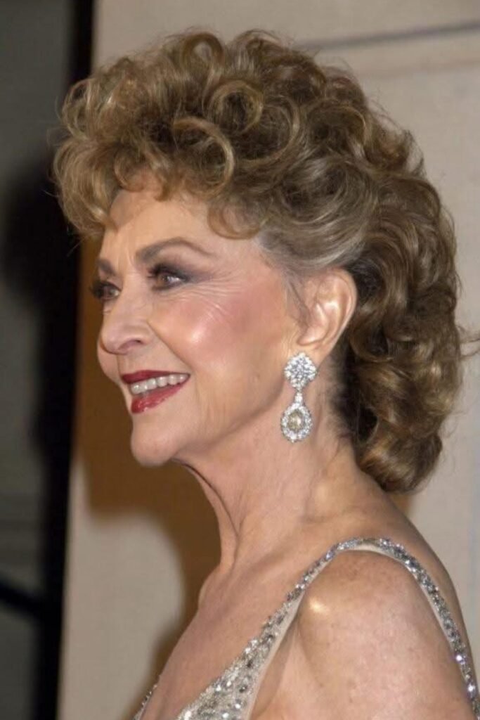 Elegant Voluminous Updo with Soft Curls