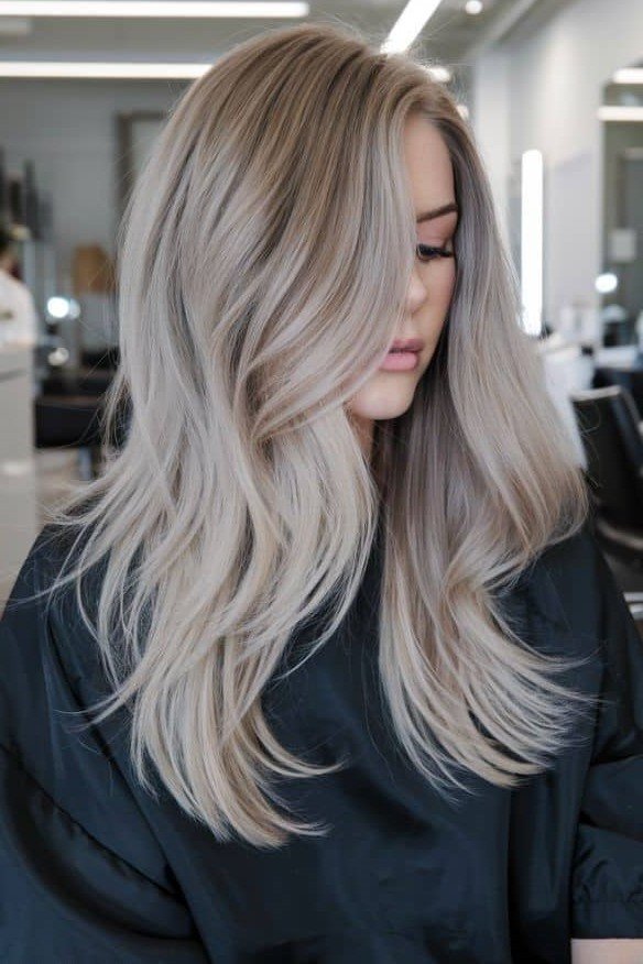 Icy Blonde Layered Cut with Soft Waves