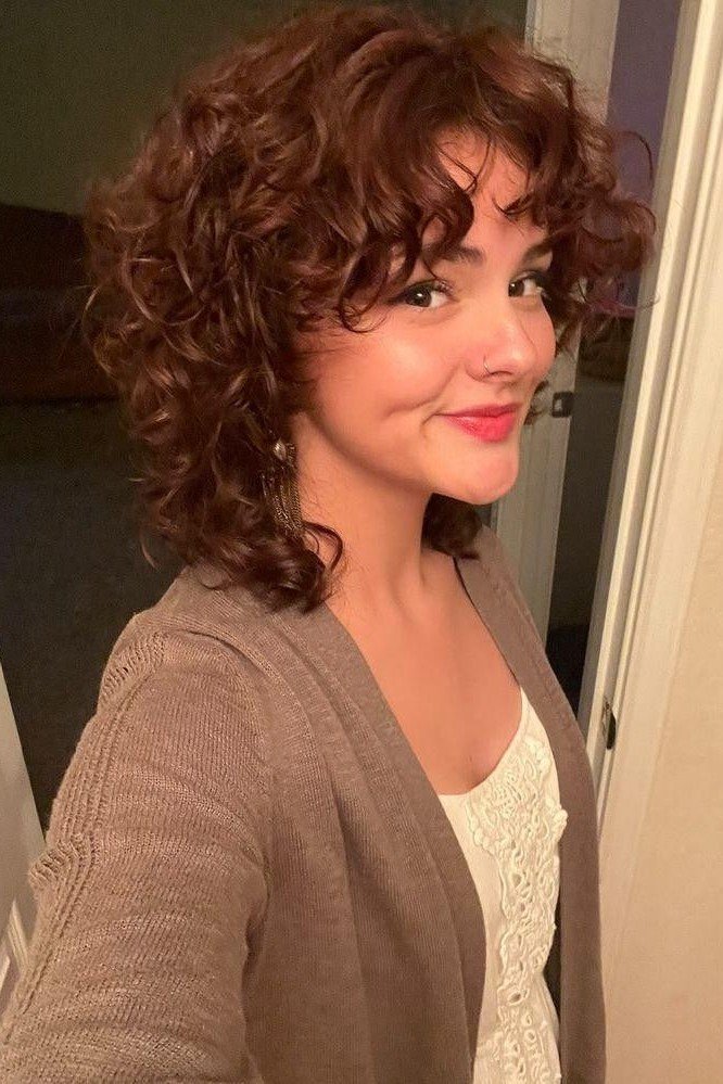 Layered Curly Shag with Side-Swept Bangs