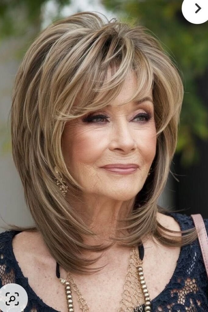Layered Shoulder-Length Cut with Feathered Curtain Bangs