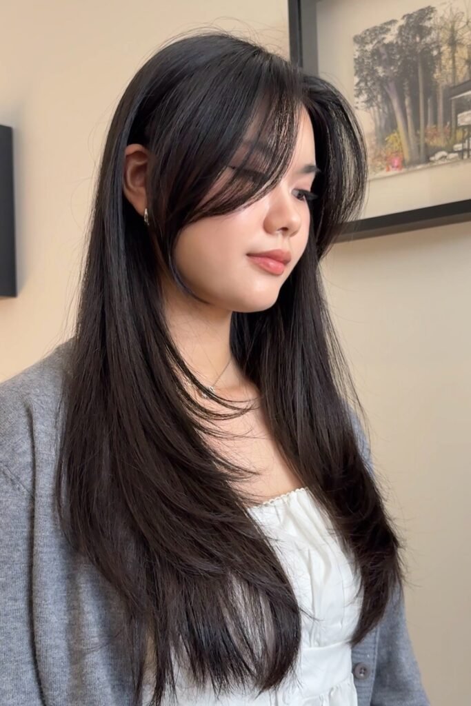 Long Layered Hair with Face-Framing Curtain Bangs