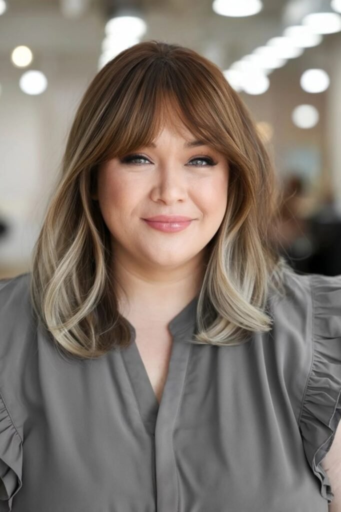 Medium Bob with Side-Swept Bangs and Face-Framing Highlights
