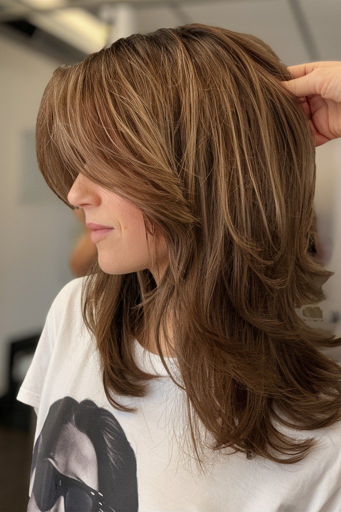 Medium Layered Hair with Face-Framing Curtain Bangs