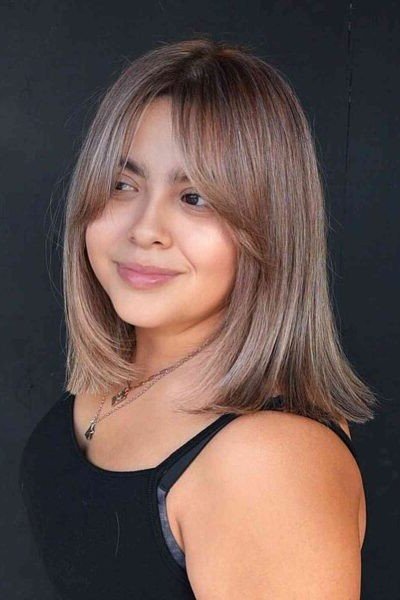 Medium Length Hair with Curtain Bangs and Subtle Layers