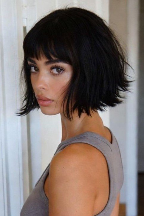 Messy Dark Bob with Textured Ends and Straight Bangs