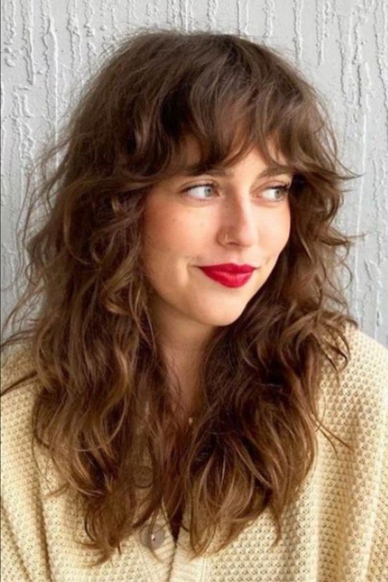 Shaggy Long Haircut with Layered Waves and Curtain Bangs