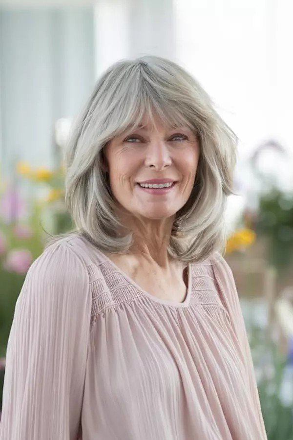 Shoulder-Length Layered Cut with Soft Curtain Bangs