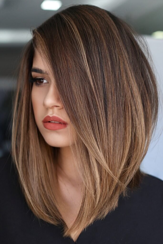Sleek Asymmetrical Bob with Caramel Highlights