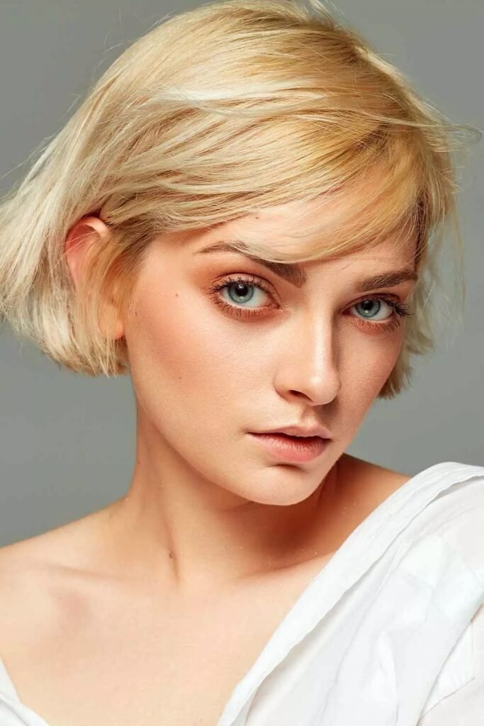 Sleek Blonde Short Bob with Side Swept Fringe