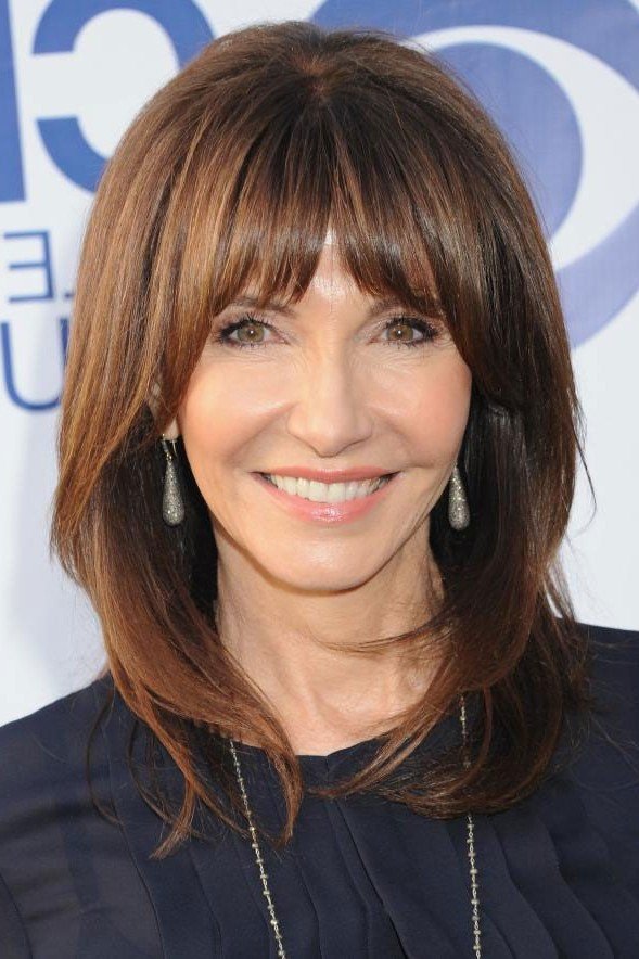 Sleek Layered Hair with Straight Fringe