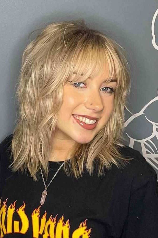 Textured Blonde Shag Hair with Soft Bangs