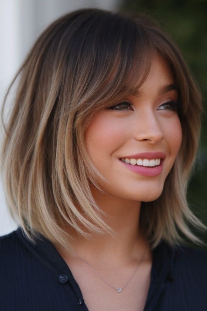 Textured Bob with Curtain Bangs and Soft Highlights