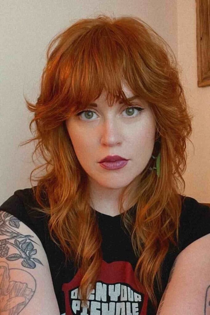 Textured Red Shag Haircut with Curtain Bangs