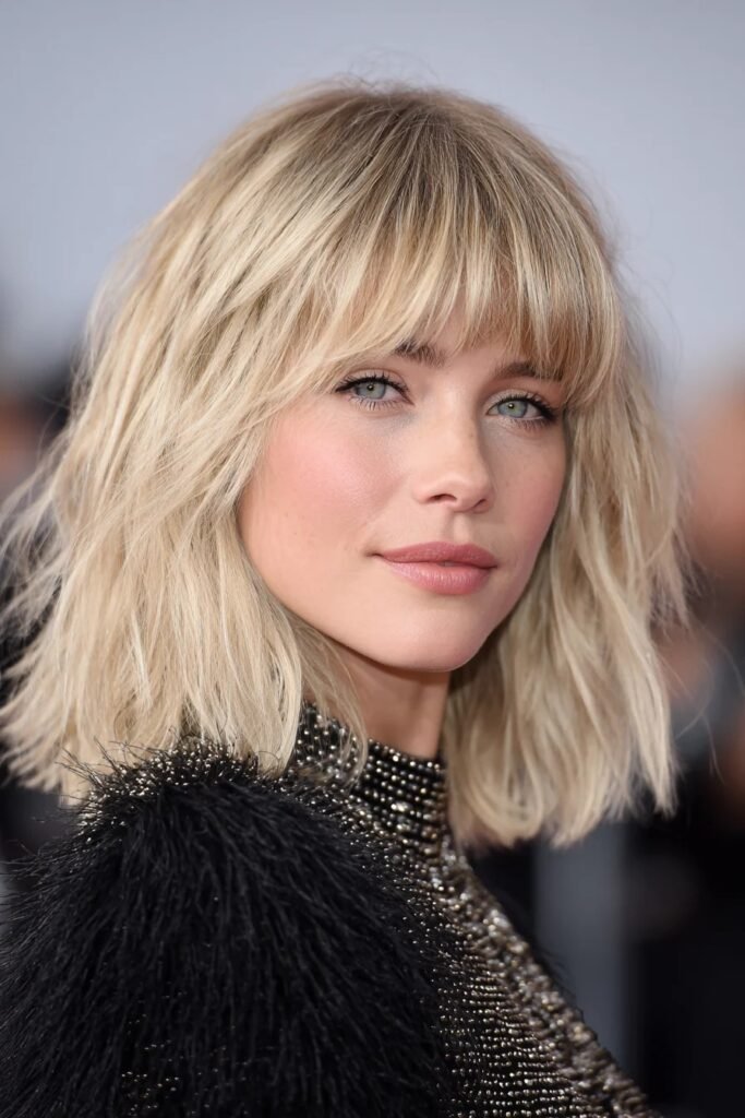 Texturized Shaggy Blonde Bob with Full Bangs