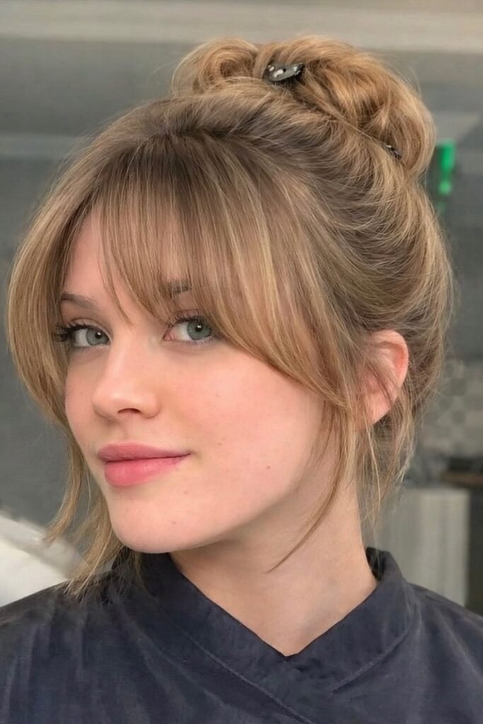 Updo with Wispy Bangs and Loose Face-Framing Pieces