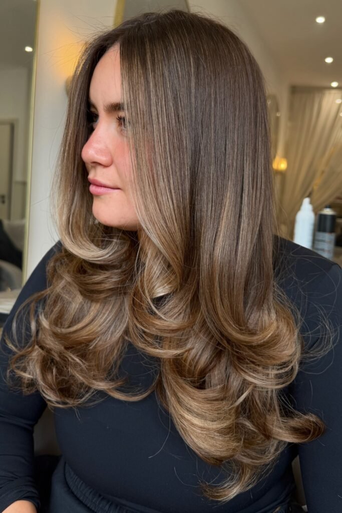 Voluminous Layered Hair with Face-Framing Waves