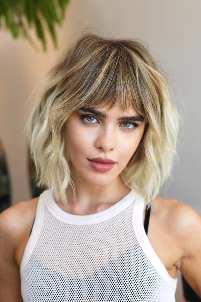 Wavy Blonde Shag Cut with Piecey Bangs