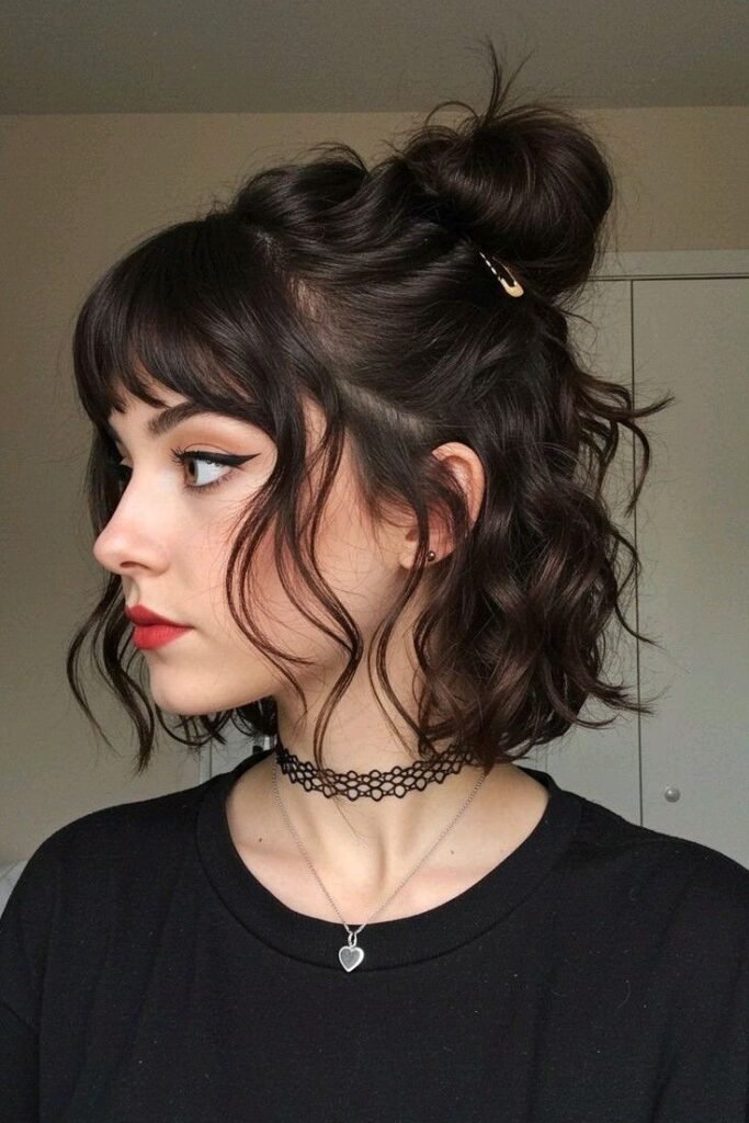 Wavy Half-Up Top Knot with Face-Framing Curtain Bangs