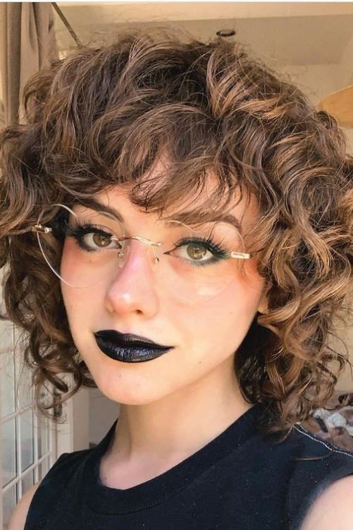 Wavy Layered Bob with Rimless Glasses and Dark Lipstick